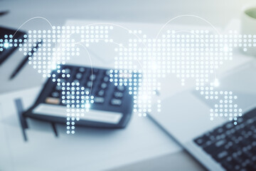 Wall Mural - abstract virtual world map with connections on calculator and laptop background, international tradi