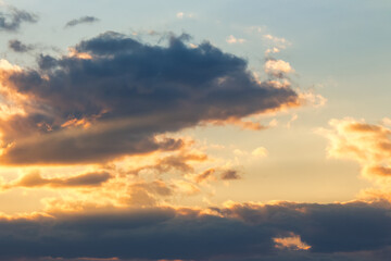 Wall Mural - dramatic sky at sunset. beautiful cloud formations in evening light