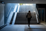 Fototapeta  - Kobieta idąca podziemnym przejściem dla pieszych