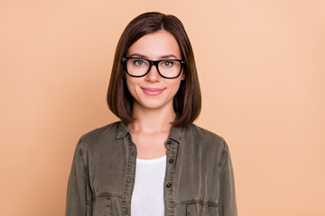 Sticker - Photo of confident cheerful nice pretty lady look camera wear eyeglasses khaki shirt isolated beige color background