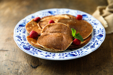 Wall Mural - Traditional homemade pancakes with raspberry