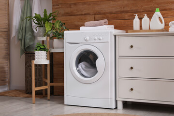 Poster - Laundry room interior with washing machine and stylish furniture