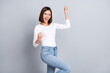 Photo of hooray bob hairstyle young lady yell wear white sweater jeans isolated on grey color background