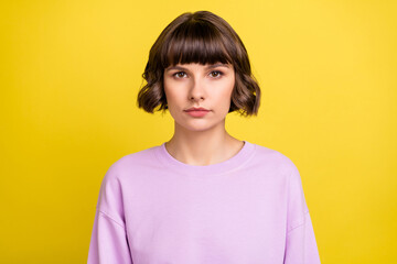 Sticker - Portrait of attractive content calm brown-haired girl wearing cozy pullover isolated over bright yellow color background