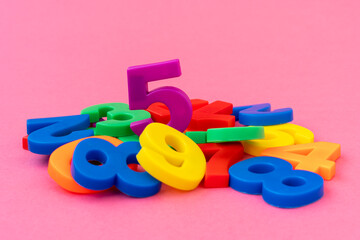 Wall Mural - Pile of colored plastic numbers