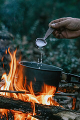 Wall Mural - Boiling milk over the campfire