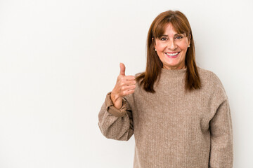 Wall Mural - Middle age caucasian woman isolated on white background smiling and raising thumb up