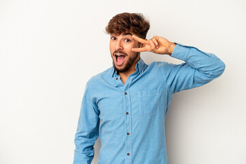 Wall Mural - Young mixed race man isolated on grey background dancing and having fun.