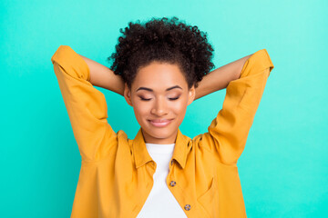 Sticker - Photo of dreamy adorable woman dressed yellow shirt closed eyes arms behind head isolated turquoise color background