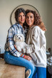 © Westend61 - Happy mother with daughter sitting with dog at table