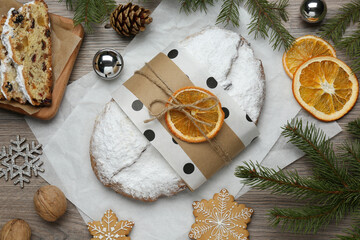 Wall Mural - Decorated traditional Christmas Stollen on wooden table, flat lay