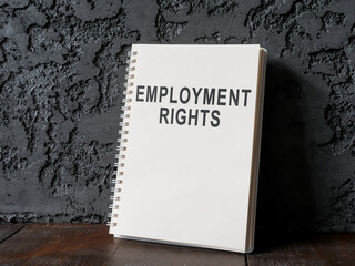 Wall Mural - Employment rights book near a dark wall.