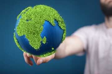 Wall Mural - Ecology concept of green Earth globe made of leaves