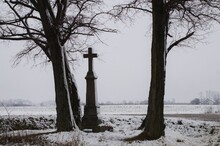 An Old Roadside Shrine In The Winter Landscape Of Poland