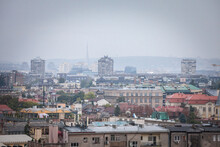 Skyline Of New Belgrade, Or Novi Beograd, In Serbia, Since From Zemun, With Bruatlist Residential Skyscraper Towers Blurred Due To An Autumn Foggy Rain. Novi Beograd Is Business District Of Belgrade