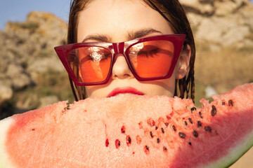 Wall Mural - cheerful woman in sunglasses and watermelon nature rocks