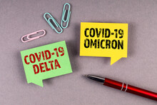 Covid-19 Delta And Omicron. Yellow And Green Speech Bubble On A Gray Background