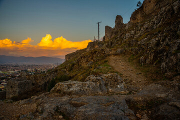 Wall Mural - FETHIYE, TURKEY: Ruined castle over the city of Fethiye on a in the evening.