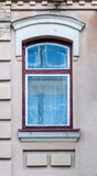 Fototapeta Londyn - Arched window in plastered wall