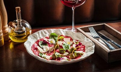 Wall Mural - meat carpaccio with parmesan cheese