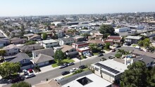 Aerial Shot Of Houses In A Residential Area On A Warm, Sunny Day, Concept For Housing Market And Real Estate Investment. Huntington Beach, California, USA.