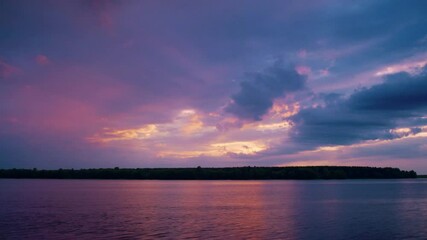 Wall Mural - Cloudy sunset over the lake, time-laps