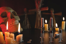 Voodoo And Candles. Skull And Syringes On A Black Background. People Management Concept. Compulsory Vaccination. Drugs And Medicine. Ritual And Conspiracy.