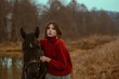 © Victoria Fox - Outdoor autumn portrait of elegant fashionable woman wearing stylish knitted turtleneck sweater posing with horse in nature. Copy, empty space for text
