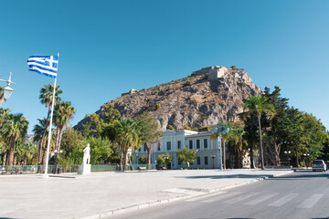 Wall Mural - Urban are with restaurants and bars on narrow street in famous Mediterranean town of Nafplio, Greece