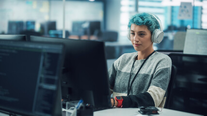 Canvas Print - In Diverse Office: Young Stylish Woman in Headphones Working on Desktop Computer. Digital Entrepreneur Creating Modern Content, Colorful e-Commerce Project Design, e-Business Social Media Strategy