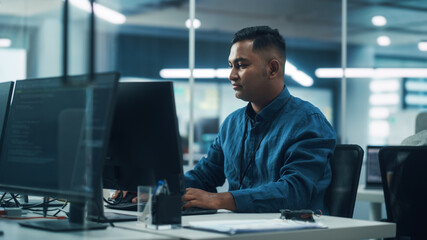 Poster - In Diverse Office: Portrait of Handsome Indian Man Working on Desktop Computer. Focused Professional Creates Innovative Software, Modern App Design. Stylish Multi-Ethnic Authentic Workplace