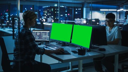 Aufkleber - Diverse Teamwork in Office at Night: Person with Disability Using Prosthetic Arm to Work on Green Screen Chroma Key Computer. Team of Software Engineers work Late to create Innovative App