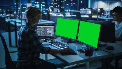 Aufkleber - Night Office: Person with Disability Using Prosthetic Arm to Work on Green Screen Chroma Key Computer. Swift and Natural Use of Myoelectric Bionic Hand To Type Code for Software at Night.