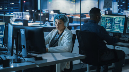 Poster - Diverse Office at Night: Multi-Ethnic Team of Young Programmers Working on Computers, Screens Show Coding Language User Interface. Software Engineers Create Innovative e-Commerce App.
