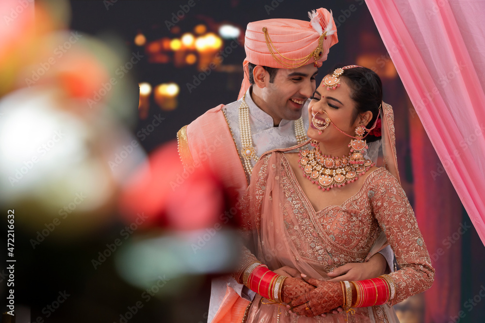 Portrait of an Indian wedding couple posing for album Stock Photo ...