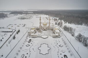 Wall Mural - Scenic aerial view of The White Mosque - architectural pearl of ancient russian town Bolgar in Tatarstan republic in Russian Federation. Beautiful winter look of muslim temple in old touristic city