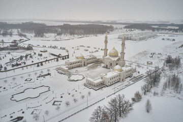 Wall Mural - Scenic aerial view of The White Mosque - architectural pearl of ancient russian town Bolgar in Tatarstan republic in Russian Federation. Beautiful winter look of muslim temple in old touristic city