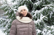 Beautiful smiling middle-aged woman in the winter outdoors. Winter concept