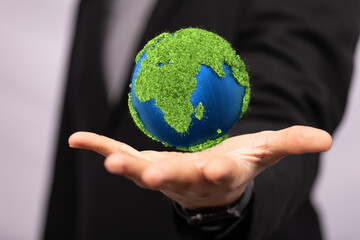 ecology concept of green earth globe made of leaves