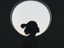 Portrait Of Silhouette Woman Against Black Background