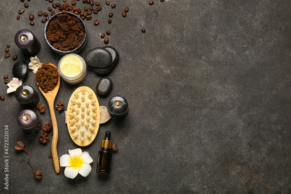 Beautiful spa composition with burning candles and coffee beans on dark background