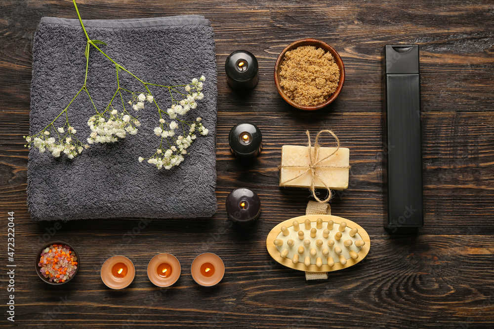 Beautiful spa composition with burning candles on dark wooden background