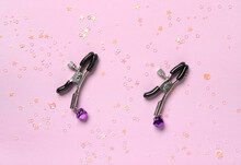 Nipple Clamps On Color Background