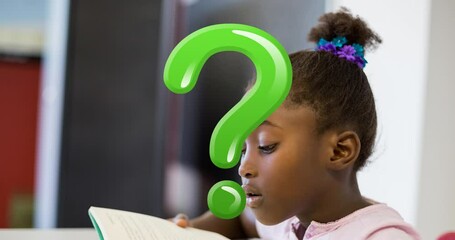 Poster - Animation of green question mark over african american schoolgirl reading in classroom