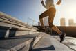 © lzf - Fitness sports woman running up stairs in city