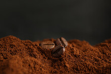 Coffee Grounds And Roasted Beans On Dark Background, Closeup