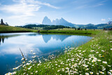 Fototapeta Góry - Summer mountain landscape in the Alps with rugged peaks reflecting in alpine lake
