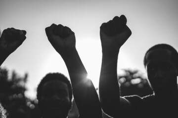 Black demonstrator people holding hands against racism - Focus on civil fists - Black and white edit