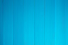 Straight Lines Or Parallel Lines Of An Iron Door Rolling Doors Made Of Metal. Line Pattern, Rectangular Shape From A Rolling Door Suitable For Making Banner, Blue Wallpaper Or Background
