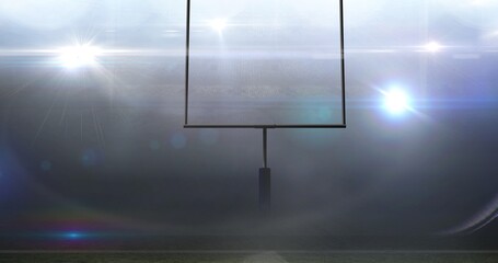 Canvas Print - Empty goal post against illuminated bright american football sports field at night